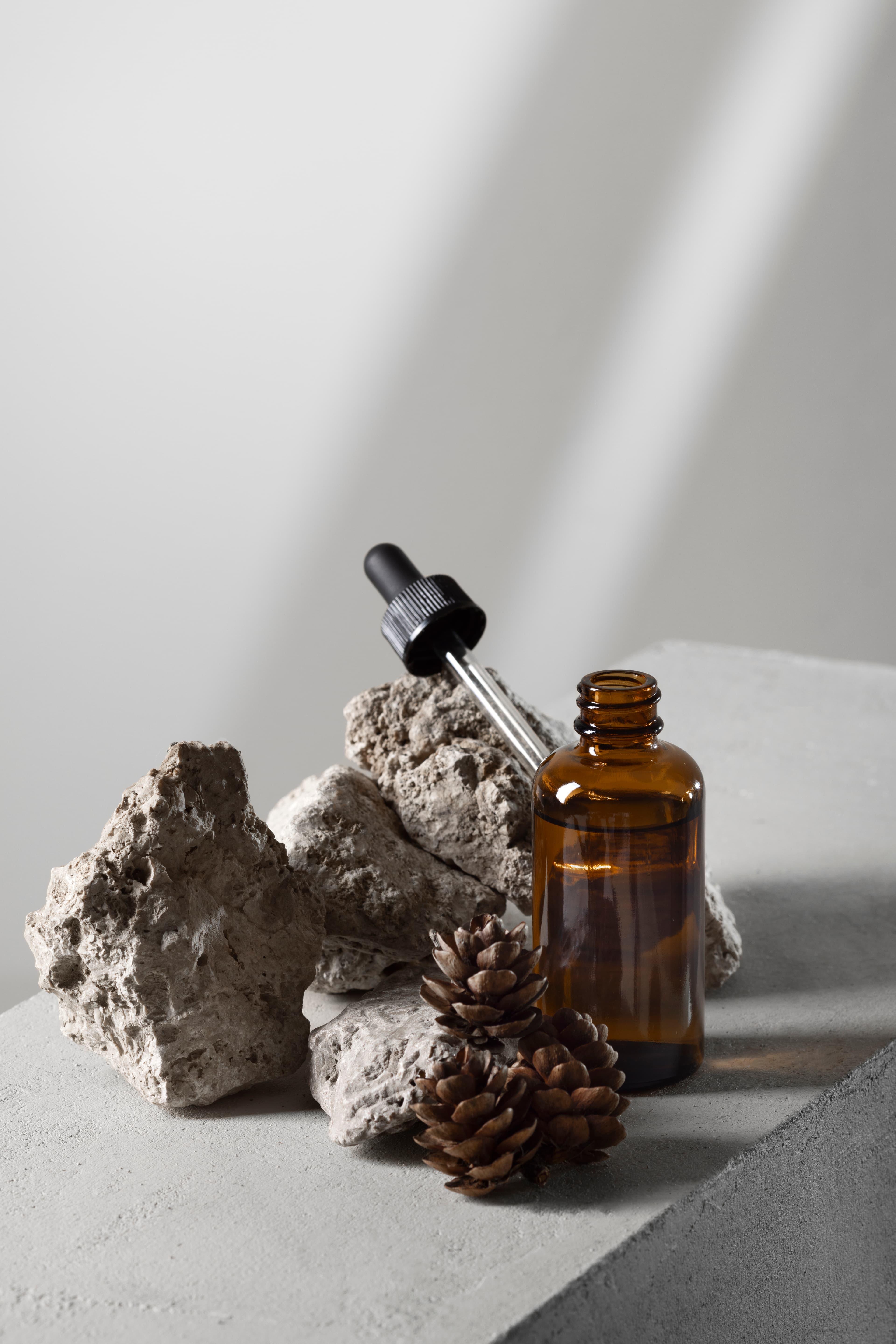 Beauty products arranged on a stone display